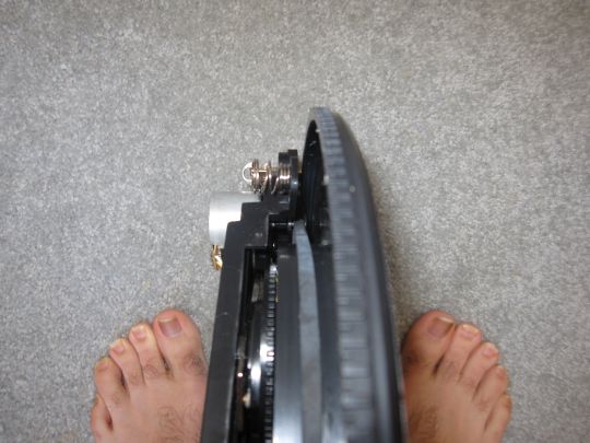 Photo shows the platter of the Crosley CR249 turntable. Focus in on the belt that wrapped around the platter and over the motor's pulley.